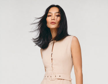 Trapezoidal dress with a bow on the shoulder - Pink